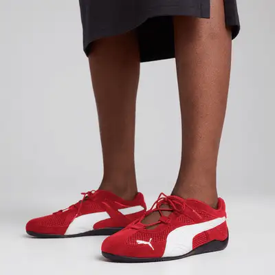 woman wearing red lace sneakers