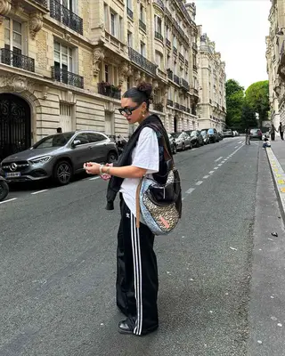 A girl wearing track pants. 