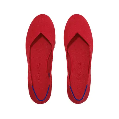 Model is wearing a long sleeveless brown top 