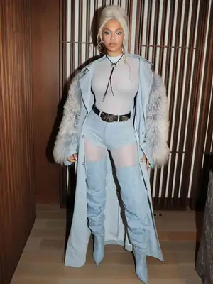 beyonce wearing all denim outfit and denim over the knee boots