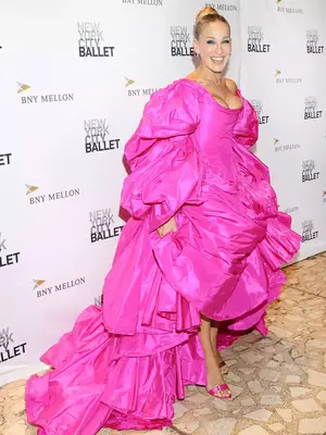 Sarah Jessica Parker wearing a voluminous hot pink ballgown and mismatched heels
