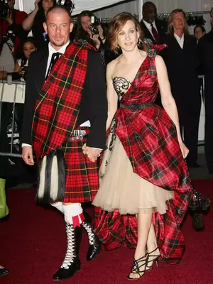 SJP at the Met Ball wearing a plaid asymmetrical dress with a beige tulle skirt and black heels