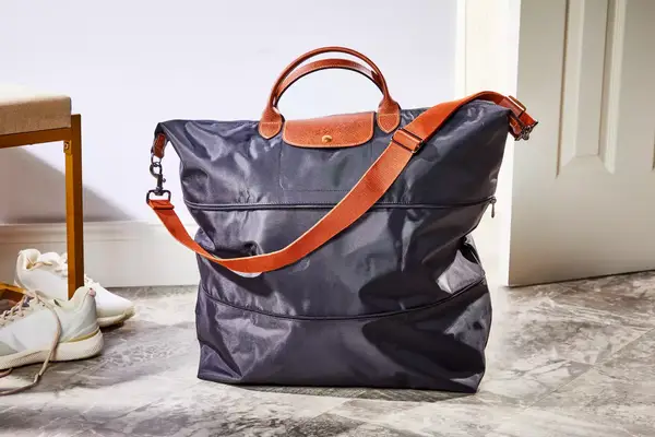 Collage of the Quince Revive Nylon Large Tote in Oxford Blue from every angle 