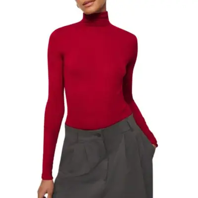 model wearing a red Reformation turtleneck