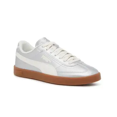 silver Puma sneakers with a brown sole