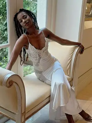 Woman wearing white slip dress with lace details