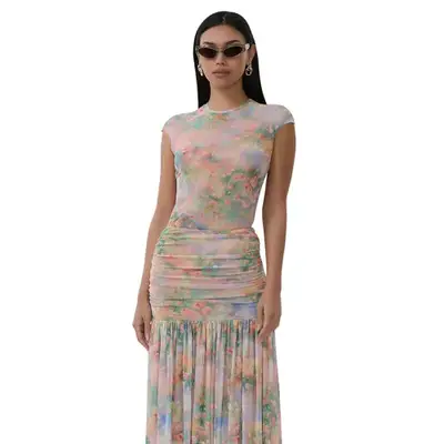 Model wearing foggy floral top and skirt set and sunglasses