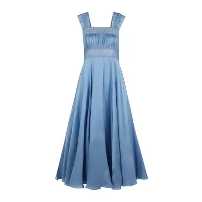 Model wearing butter yellow sheer maxi dress