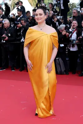 Lily Gladstone wears a silky yellow gown to the Cannes 2024 premiere of Kinds of Kindness