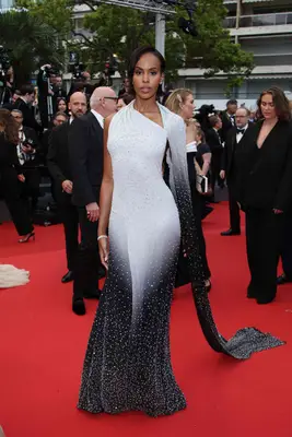 Sabrina Elba wears a black and white ombre gown with pearls to the 2024 Cannes Film Festival premiere of Furiosa