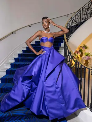 Maria Borges wears a blue bra top, ball skirt, and sparkling jewelry at Cannes 2024