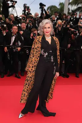 Jane Fonda wears a Forte Forte coat and Elie Saab jumpsuit to Cannes 2024