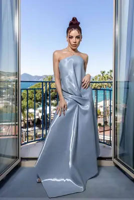 Gessika Kayane wears a light blue Kate Barton dress with knotted waist detail to Cannes 2024
