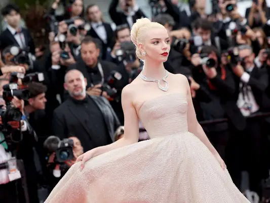 Anya Taylor-Joy wears a Dior gown and Tiffany & Co. jewelry on the Furiosa premiere red carpet at Cannes 2024