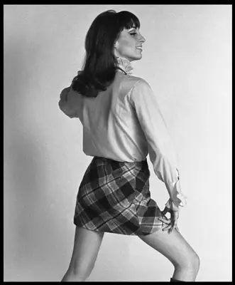 Woman wearing plaid skirt