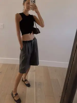 chriselle lim taking mirror selfie wearing black ballet flats