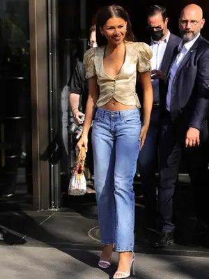 zendaya wearing low rise blue jeans