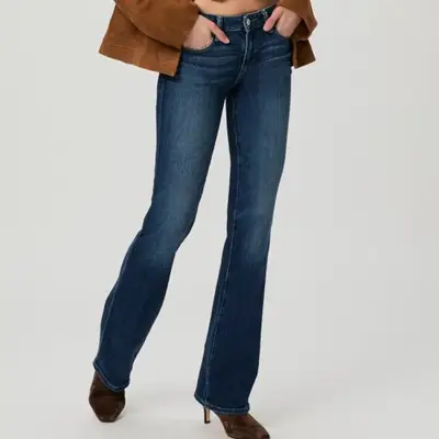 model wearing low rise jeans