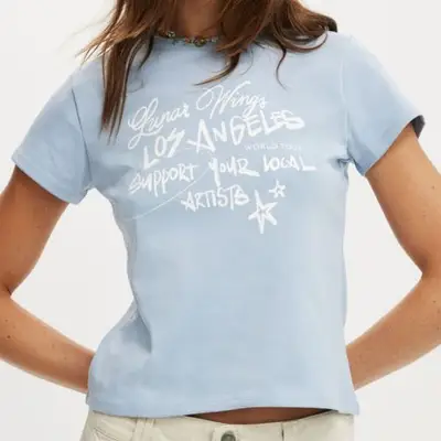 blue graphic tee that says support your local artists