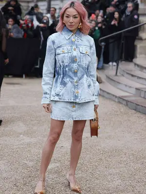 Tina Leung wearing matching denim jacket and mini skirt