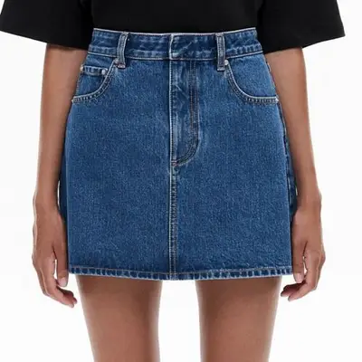 model wearing denim mini skirt