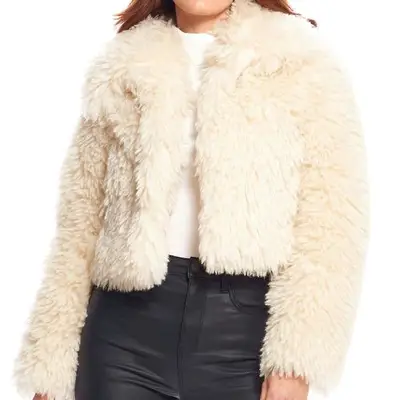 Donna Salyers Fabulous Furs Ivory Faux Sherpa Snowdrift Jacket on model styled with white t-shirt and black leather pants