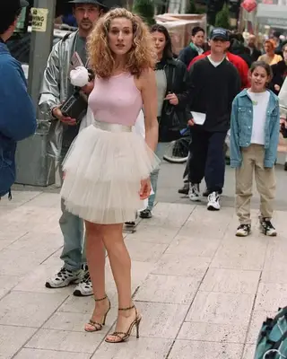 Carrie Bradshaw wearing a pink tank top with a white tutu and heels