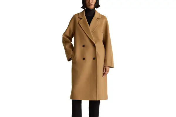 a person facing slightly to the side while wearing the Zara Soft Oversized Coat