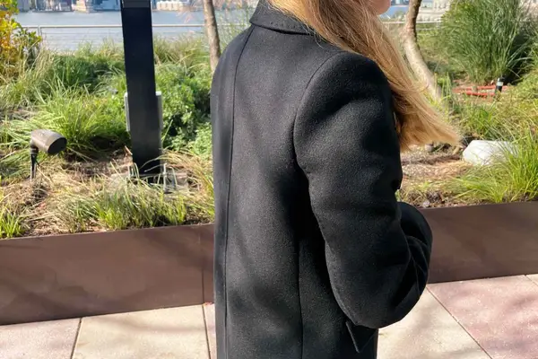 The side of the Babaton The Constant Coat on a person