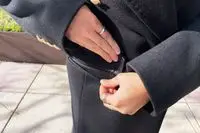 A close-up of the pocket on the Babaton The Constant Coat