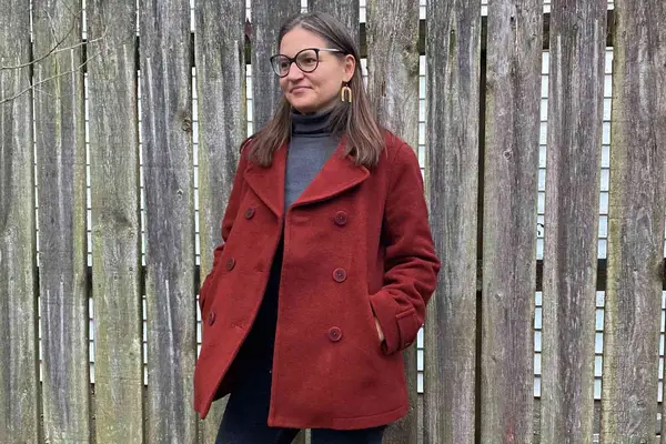 Three women wearing different wool coats collaged on a neutral background