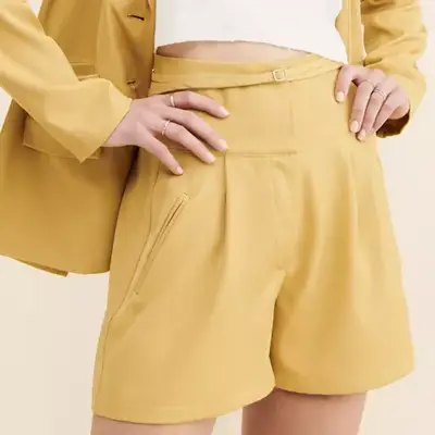 4th & Reckless Tamiko Tailored Shorts in neutral yellow on model with matching blazer and white top