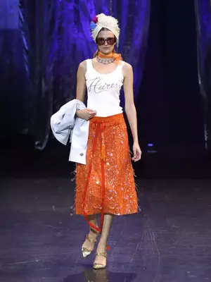 Model wearing a fringe turban, 