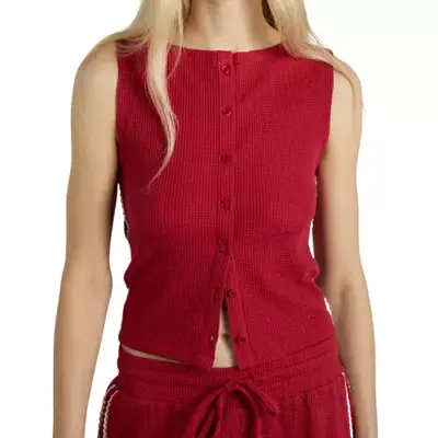 model wearing a red button-down vest