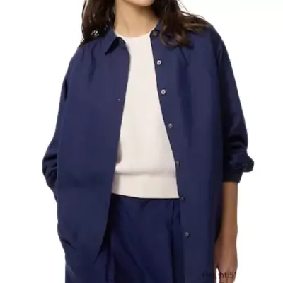 model wearing a navy button-down Uniqlo shirt