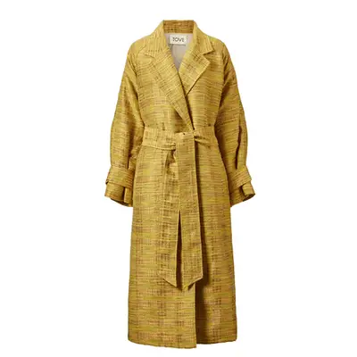 Simon Miller Bruer Coat in shiny black polyurethane on model paired with black handbag