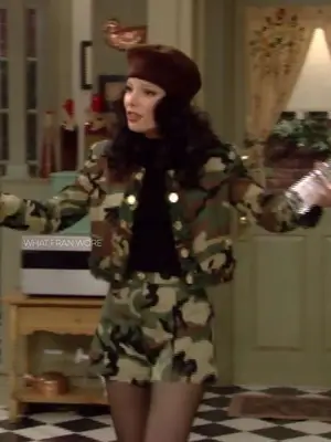 Fran Fine wearing beret hat, army print jacket, black top, and army print shorts