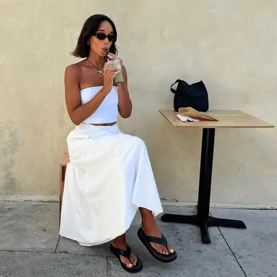 Laura Harrier wearing a bed sheet skirt