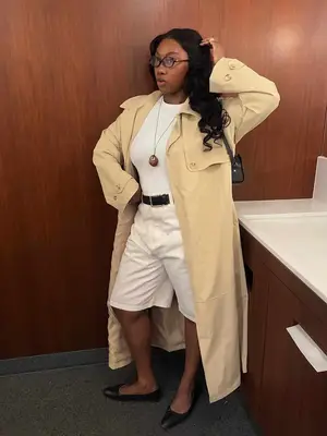 Model is wearing a blue striped tiered maxi skirt 