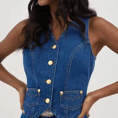 Photo of denim vest with gold Kendra Scott embellishments 