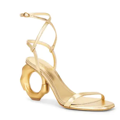 Photo of gold strappy shoe with round heel 