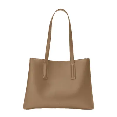 Hailey Bieber carries a black Freja New York Caroline handbag and wears a leather jacket and sunglasses