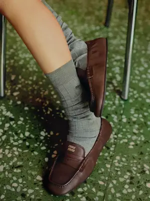 Alaia Vienne Leather Clogs in white cutout leather