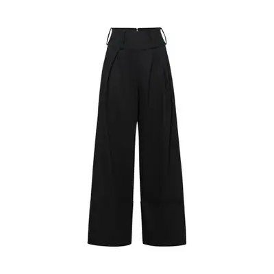 black high waisted trousers against plain background