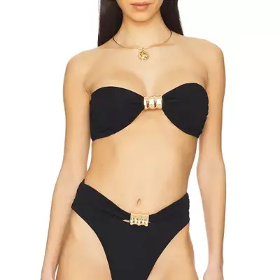 model wearing a black bandeau with gold details