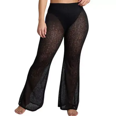 model wearing black sheer cover-up pants