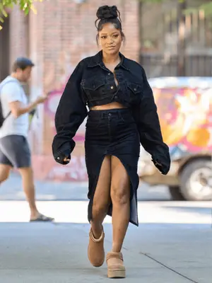 Keke Palmer wearing a denim two-piece set and platform Ugg boots.