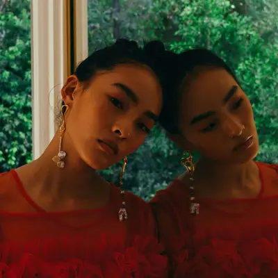 Model wearing pearl earrings