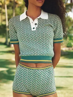 Marilyn Monroe wears a white bikini with swim shorts while standing on pool ladder