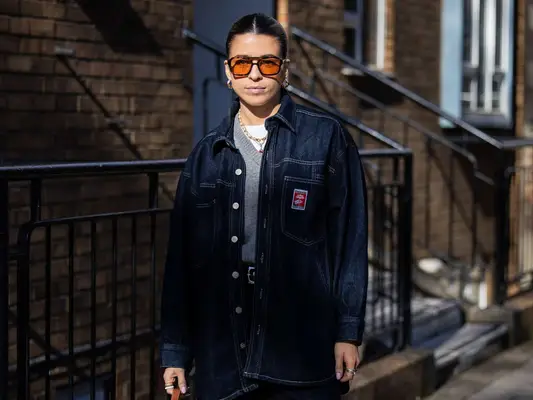 Woman wearing dark wash denim outfit